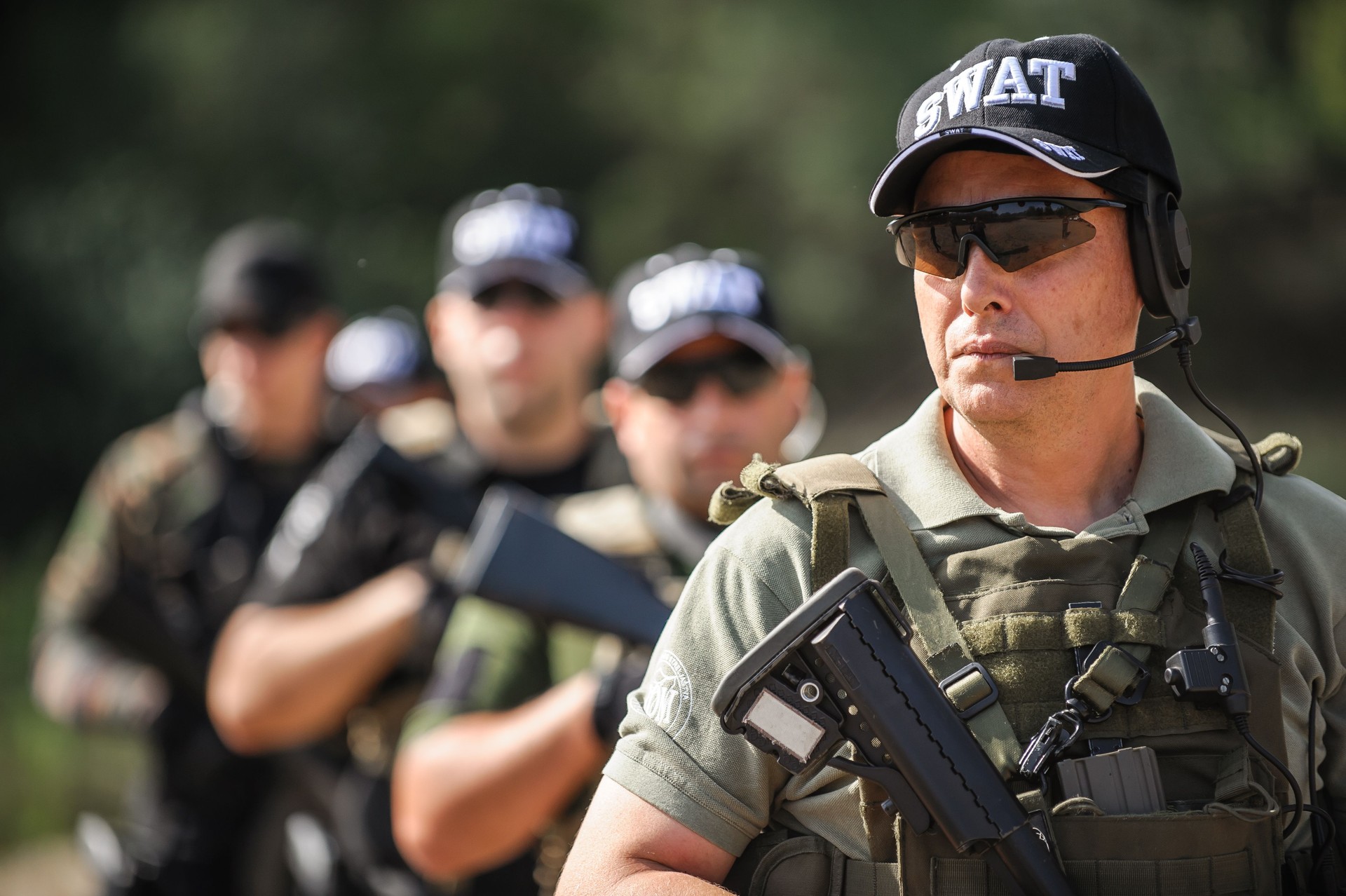 Group of full armed swat soldiers standing in column line
